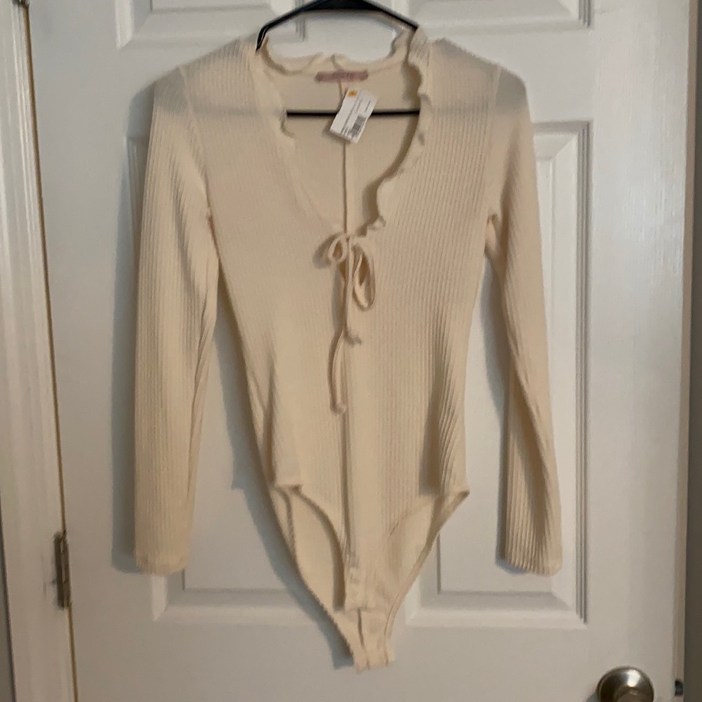 Cream ruffle bodysuit